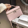 Mini bolso de mano textura lichi